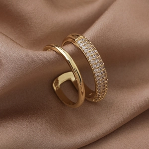 Detail of gold double-layer open ring featuring micro-pave cubic zirconia on silk
