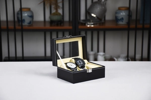Detail view of 12-slot black PU leather watch display box with clear glass lid