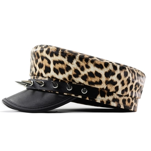 Detail view of leopard print punk military hat with metallic silver rivet spikes