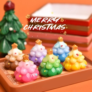 Miniature resin Christmas trees in gradient candy colors with gold star topper and ornaments