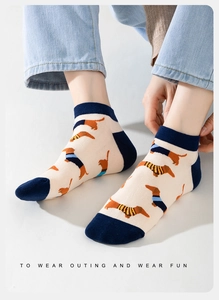 Detailed texture of cotton low-cut socks featuring cartoon dachshund patterns for men