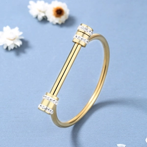 Polished gold titanium steel horseshoe buckle bangle with sparkling diamond accents