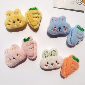 Detail of plush rabbit and carrot accessories with colorful embroidery for DIY crafts