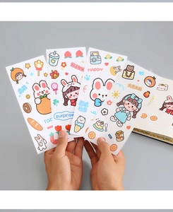 Close-up of four cute cartoon PVC stickers featuring rabbit and bear designs for journals