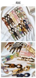 Close-up of elegant acetate U-shaped hair pins in various colors and marble patterns