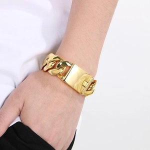Men's 24mm gold plated chunky Cuban link bracelet with rectangle safety clasp on wrist