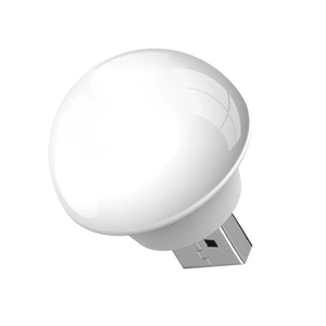 Macro shot of a white mushroom-shaped USB night light with translucent top and USB-A plug