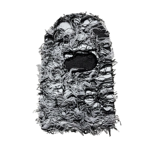 Detail of black and white distressed knit balaclava with fringe texture and street style