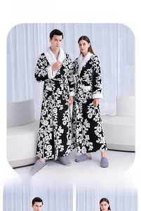 Detailed view of plush white shawl collar and navy floral jacquard pattern on a thick bathrobe