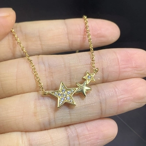 Elegant gold necklace with three linked stars featuring micro-pave zircons for women