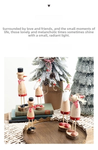Detailed view of handmade wooden Christmas figurines featuring Santa, snowman and reindeer