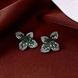 Vintage style floral stud earrings with green and white cubic zirconia in retro metal finish