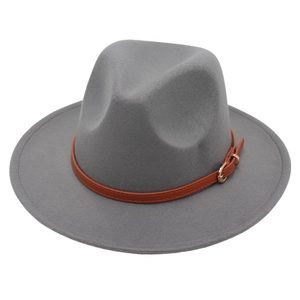 Detail of dark grey fedora hat with felt texture and brown leather belt buckle strap