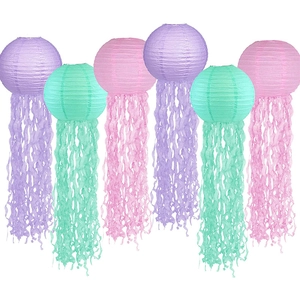 Jellyfish paper lanterns in purple, pink and teal colors for mermaid theme party decor