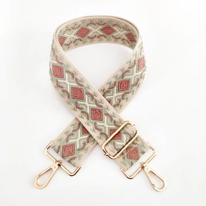 Ethnic wide jacquard bag strap with pink and green diamond patterns and gold hooks