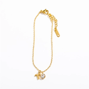 Detail of gold Aries constellation pendant with zircon stone and adjustable lobster clasp