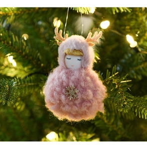 Close-up of pink plush Christmas angel ornament with deer antlers and gold snowflake