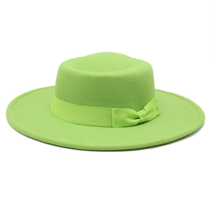 Flat top bright green wide brim wool fedora hat featuring a matching ribbon and side bow detail