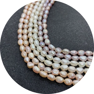 Natural freshwater pearl strands in white pink and purple with a lustrous oval finish