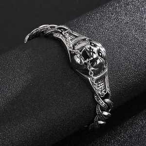 Macro shot of vintage tiger head engraved cuban chain bracelet in silver stainless steel