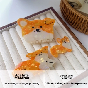 Detailed view of three cute Corgi hair clips made from premium glossy acetate material