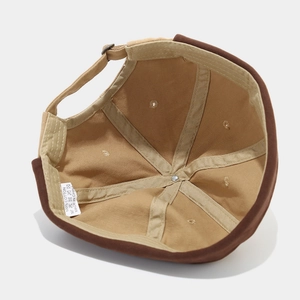 Adjustable two-tone cotton docker hat with metal buckle and interior stitch detail