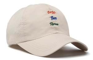 Close-up of quick-dry baseball cap featuring colorful embroidery and breathable side vents