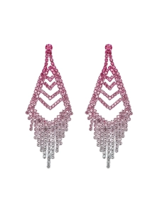 Close-up of long tassel earrings with pink gradient rhinestones and silver finish