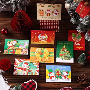 Detail of 3D pop-up Christmas cards featuring reindeer and Santa on a rustic wood base