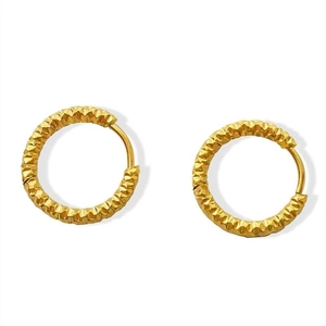 Polished gold round hoop earrings with textured diamond-cut surface on white background