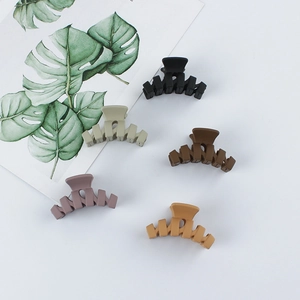 Minimalist matte shark hair clips in five colors including black and dark brown