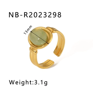 Macro view of gold stainless steel ring with 13mm oval green natural stone and ribbed band