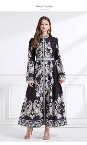 Detail of vintage high collar and buttoned paisley bodice with beige lace cuffs on black dress