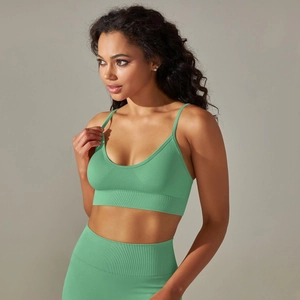 Detailed close-up of seamless mint green sports bra featuring ribbed hem and thin straps