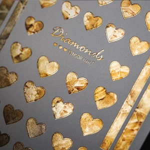 Chic gray matte nail stickers with gold heart patterns and marble fluid texture