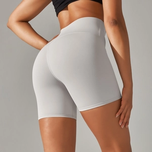 Detailed back view of high-waisted grey yoga shorts showing peach lift stitching