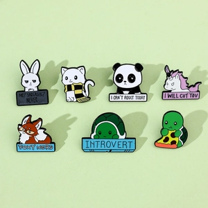 Detailed set of 7 colorful enamel animal pins with witty quotes on green background