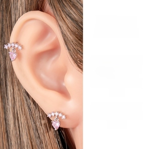 Detail of pink heart cartilage earring featuring cubic zirconia and silver-tone metal