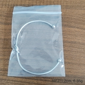 Minimalist silver knot cuff bangle bracelet in stainless steel with ball ends design