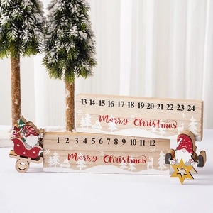 Wooden Christmas countdown calendar featuring gnome and Santa figurines on a desk
