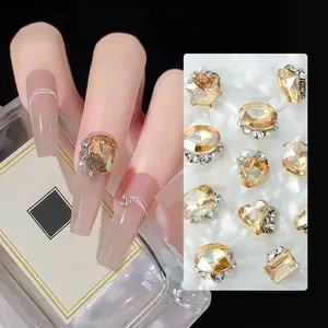 Macro detail of mixed champagne nail sequins in star and heart shapes with metal base