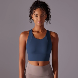 Detail of high-stretch sports bra and yoga leggings with side pockets on model