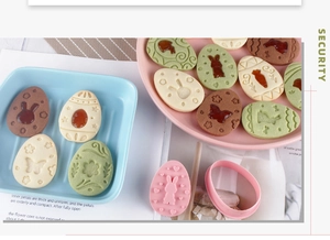 Detail showing Easter cookie molds with bunny patterns and jam-filled cookie results