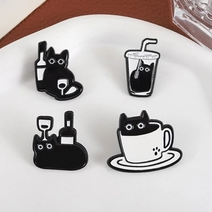 Set of four creative black cat enamel pins featuring coffee and drink themes on white tray