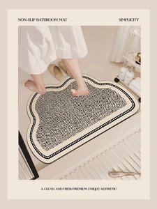 Detail of non-slip absorbent bathroom mat with geometric pattern under bare feet