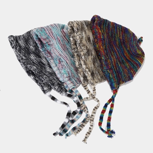 Colorful knitted winter beanie with ear flaps and long braided straps in four mixed colors