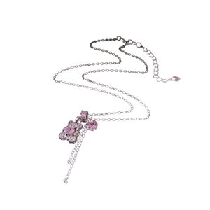 French style silver necklace with pink gemstone bear pendant on white background