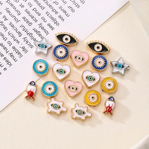 Macro shot of assorted evil eye alloy beads in star, heart, and animal shapes for DIY crafts