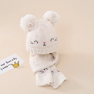 Detailed knit texture and cute cat embroidery on baby hat and scarf set in beige