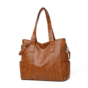 Brown large capacity leather tote bag for women with soft texture and shoulder straps